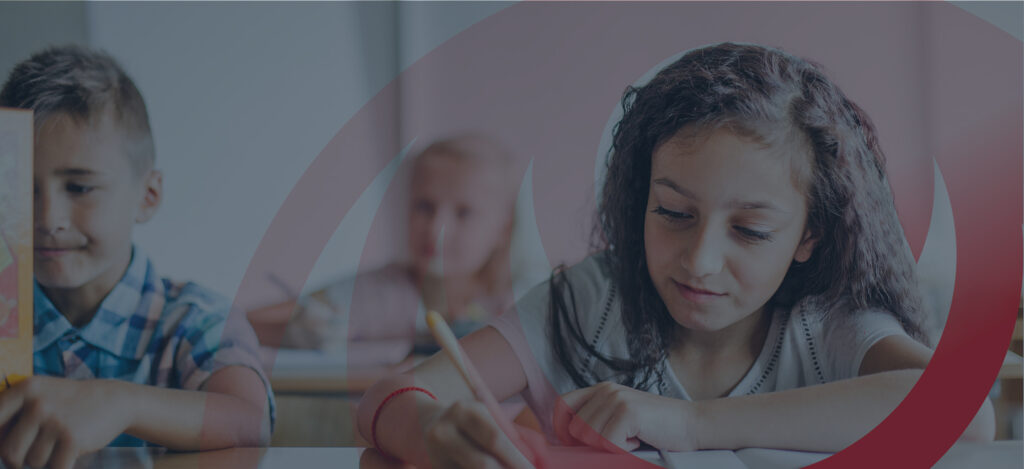 Girl focused on classroom writing activity – Redshift Education background image